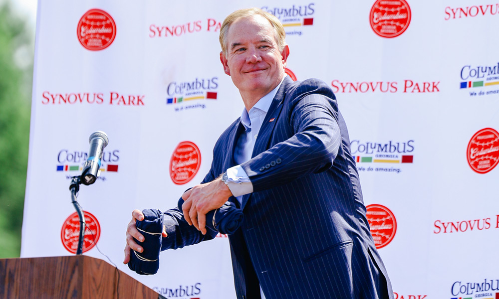 Kevin Blair, Synovus Chairman, CEO and President, celebrates during the groundbreaking